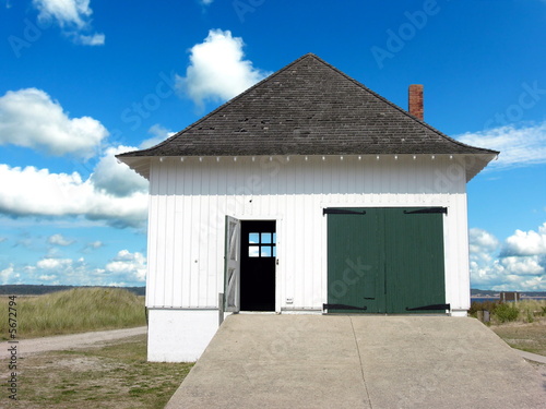 island boathouse against summer sky photo