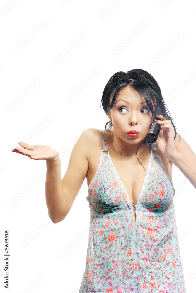Pretty brunette shruging shoulders and talking by telephone Pretty brunette shruging shoulders and talking by telephone