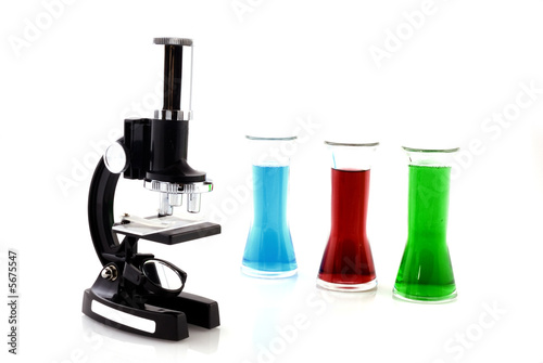 microscope and glasses with liquid in the laboratory