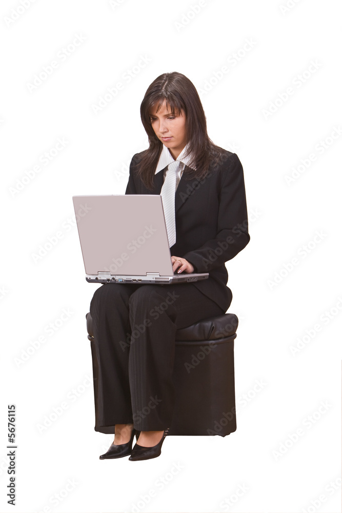 Businesswoman sitting on a chair and working on a laptop. Businesswoman sitting on a chair and working on a laptop.
