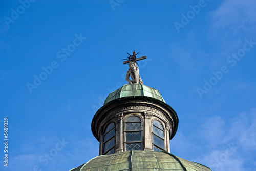Dome of a cathedral with statue of Jesus Christ. Lviv, Ukraine.