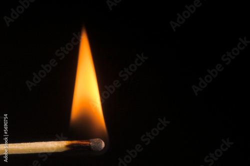 Image of a wooden kitchen match as it burns.