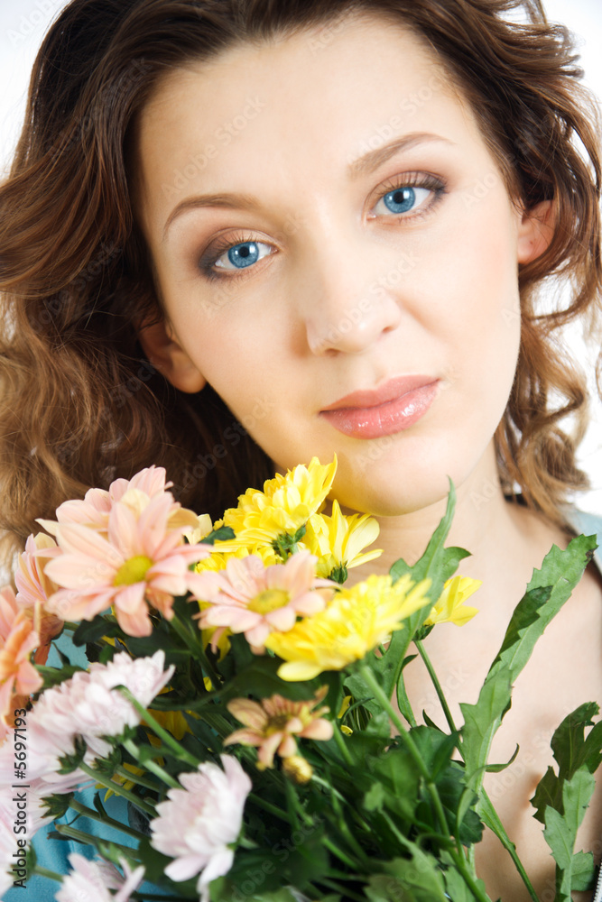 Portrait gorgeous women with flowers. Close-up.