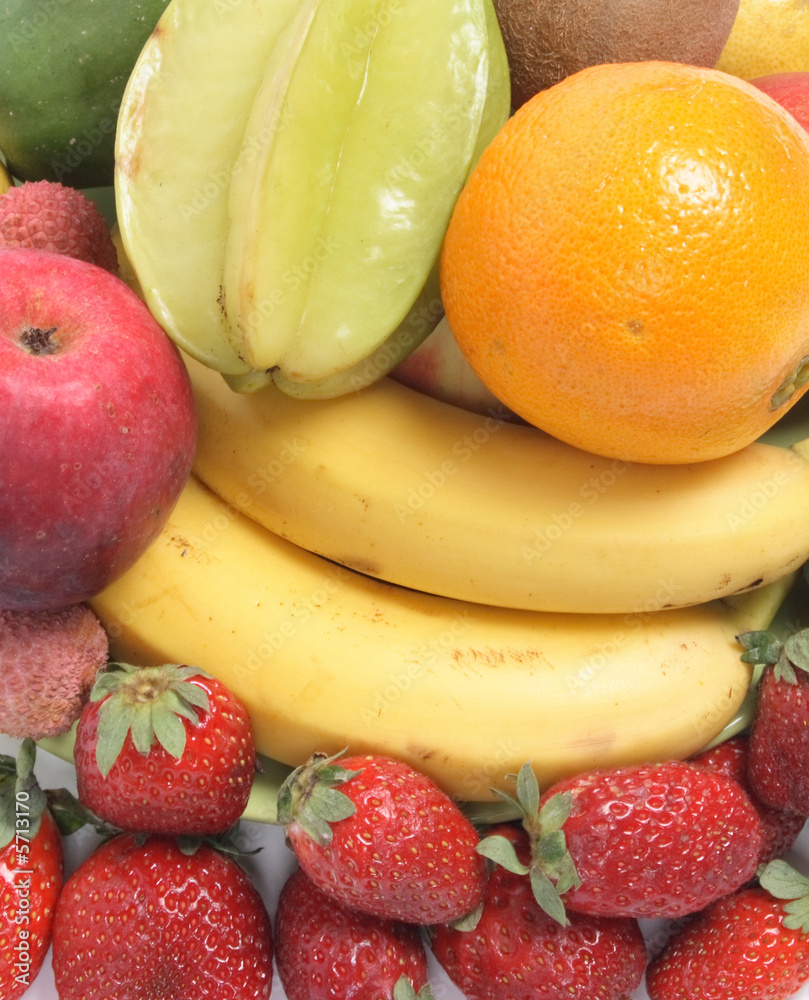 fresh color fruits background with banana and strawberries fresh color fruits background with banana and strawberries