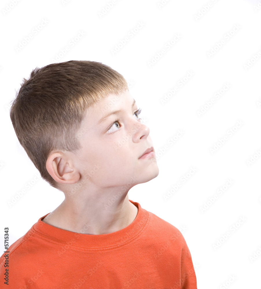 Young boy with a contemplative expression looking up. Young boy with a contemplative expression looking up.