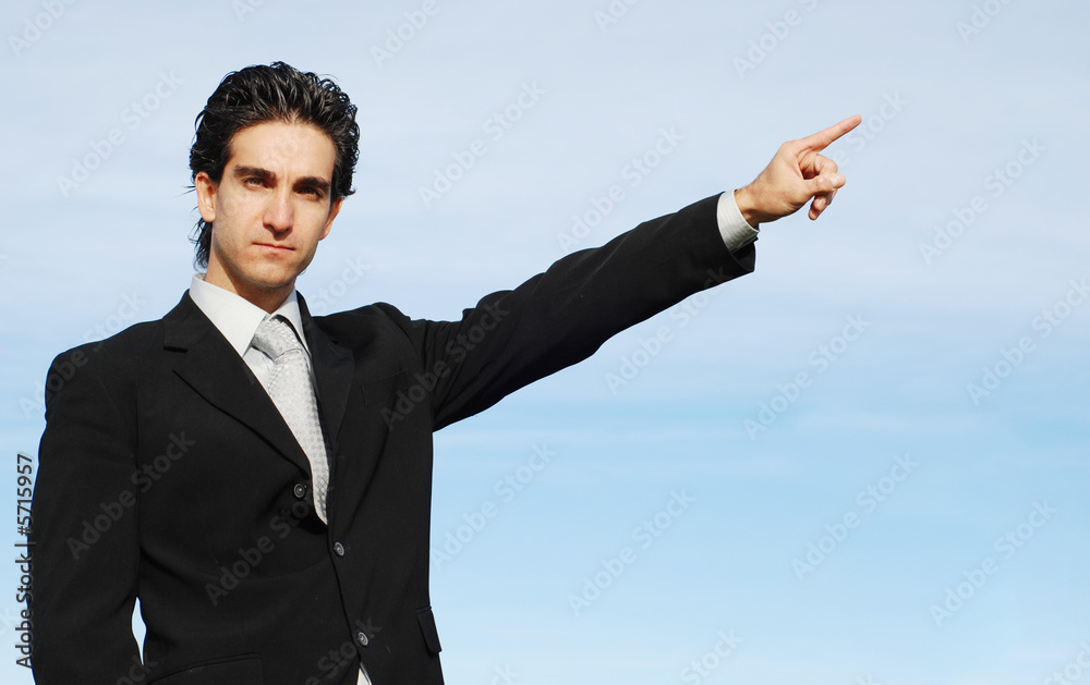successful businessman is posing against the sky successful businessman is posing against the sky