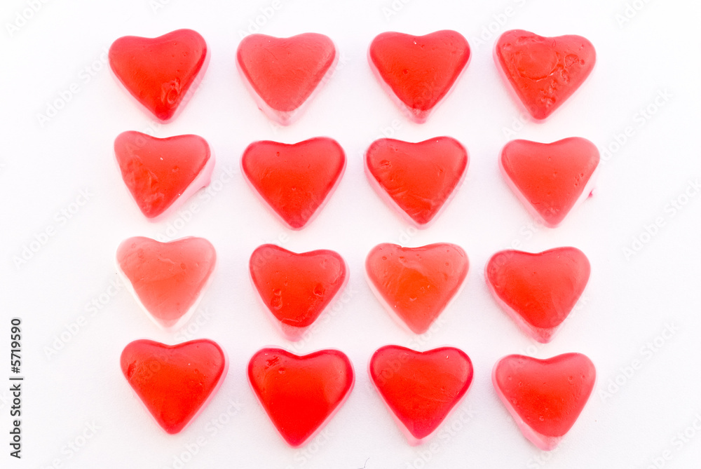 Close up red candy hearts in square isolated on white