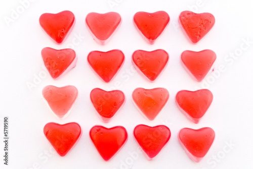 Close up red candy hearts in square isolated on white