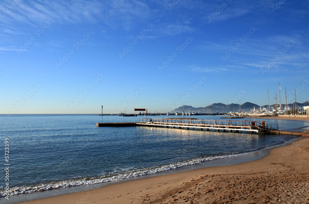 Small pier by the Mediterranean Sea in Cannes, French Riviera.