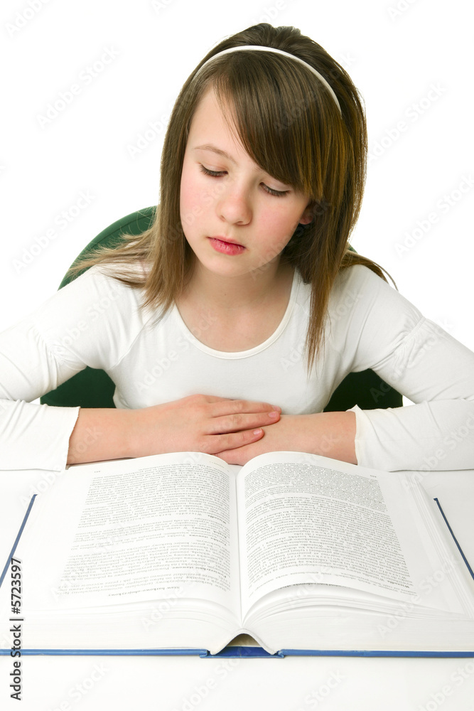 Portrait of Happy young schoolgirl reading book Portrait of Happy young schoolgirl reading book
