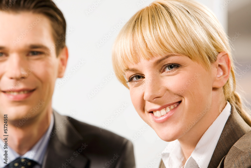 Face of young smiling woman with charming smile in front Face of young smiling woman with charming smile in front