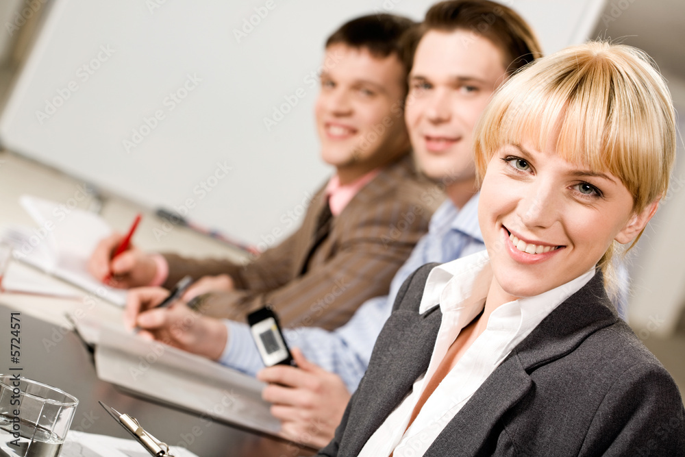 Portrait of pretty employee looking at camera Portrait of pretty employee looking at camera