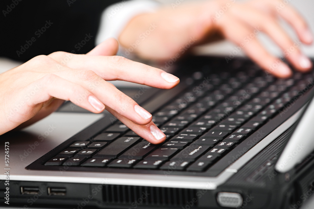 Image of beautiful female hands pushing the buttons Image of beautiful female hands pushing the buttons