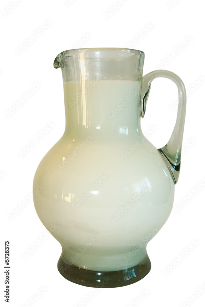 Jug filled by milk on a white background