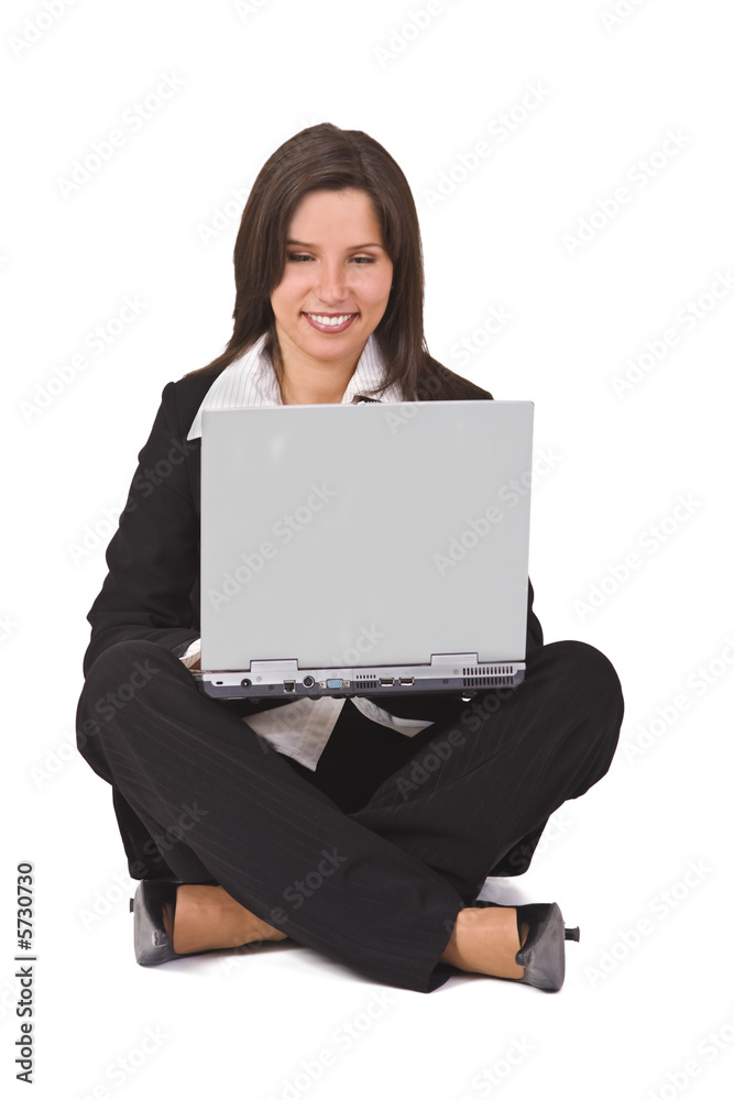 Businesswoman sitting with a laptop in her lap Businesswoman sitting with a laptop in her lap