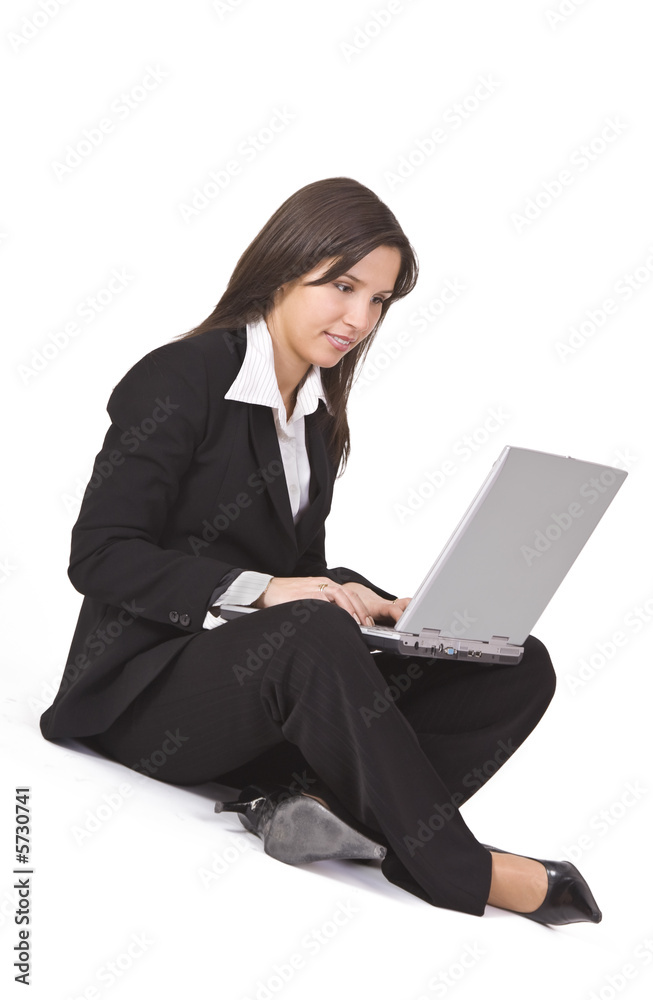 Brunette businesswoman working on a laptop. Brunette businesswoman working on a laptop.