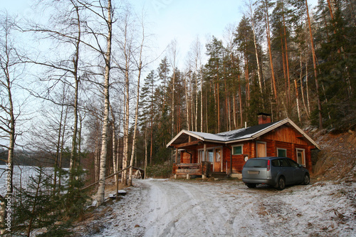 wooden cottage in the forest with car near © ta_samaya