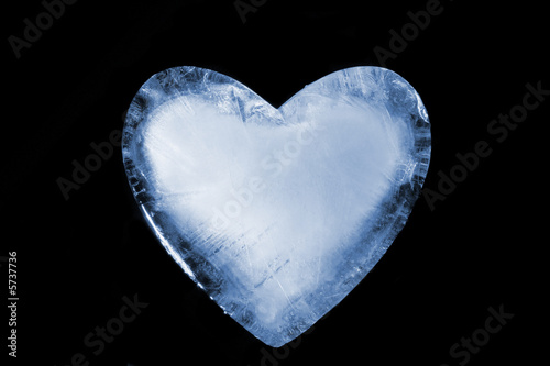 An ice cold blue heart. Over black.