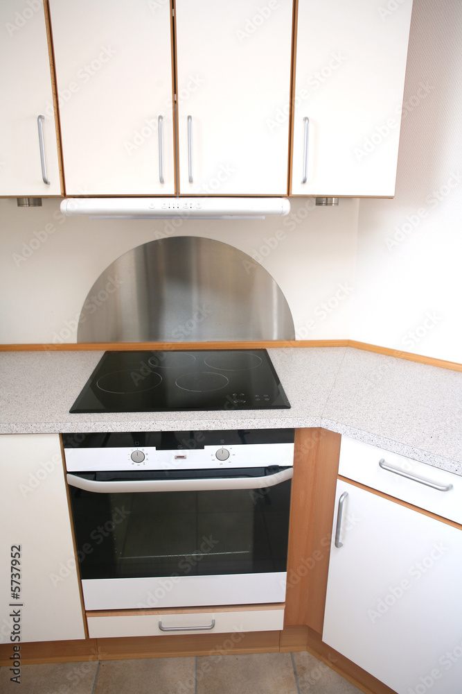 Fototapeta premium In a modern kitchen el cooker with ceramic plate
