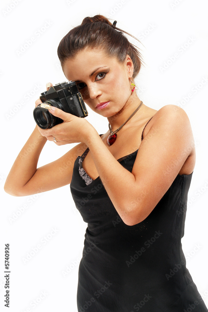 Sexy girl with old photo camera watching you. Sexy girl with old photo camera watching you.