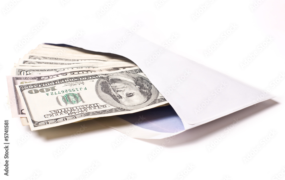 Dollars in envelope against white background. Shallow DOF..