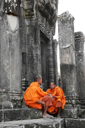 two young monks on temple background photo