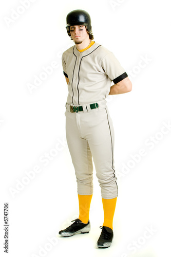 Photography A young male baseball player standing.