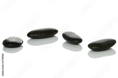 Four black pebbles.