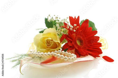 collection of flowers with a perls on white background photo