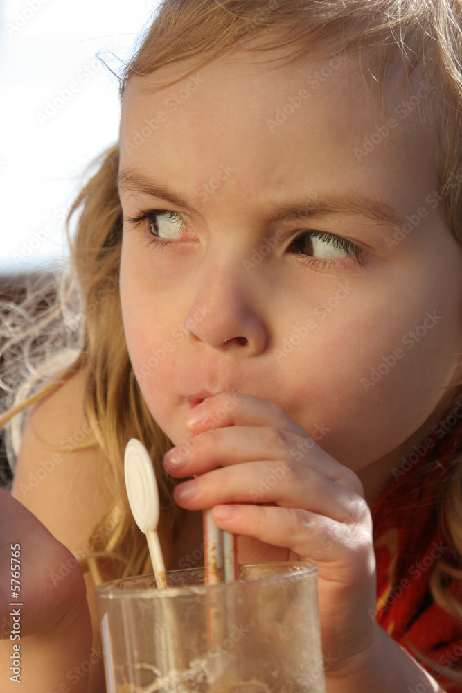 this is my drink! closeup girl drinking from glass this is my drink! closeup girl drinking from glass