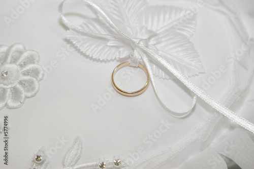 wedding ring on white pillow