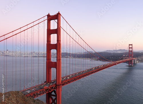 Sunset sky behind Golden Gate Bridge. Copyspace on top right.