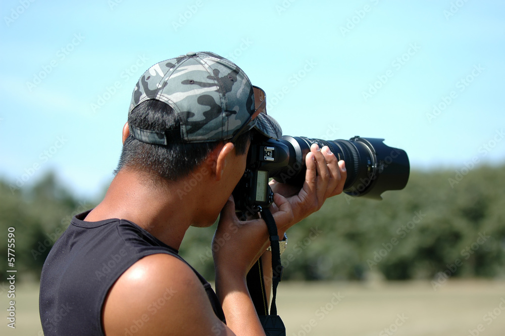 Photographer is taken pictures on a hot summer day.