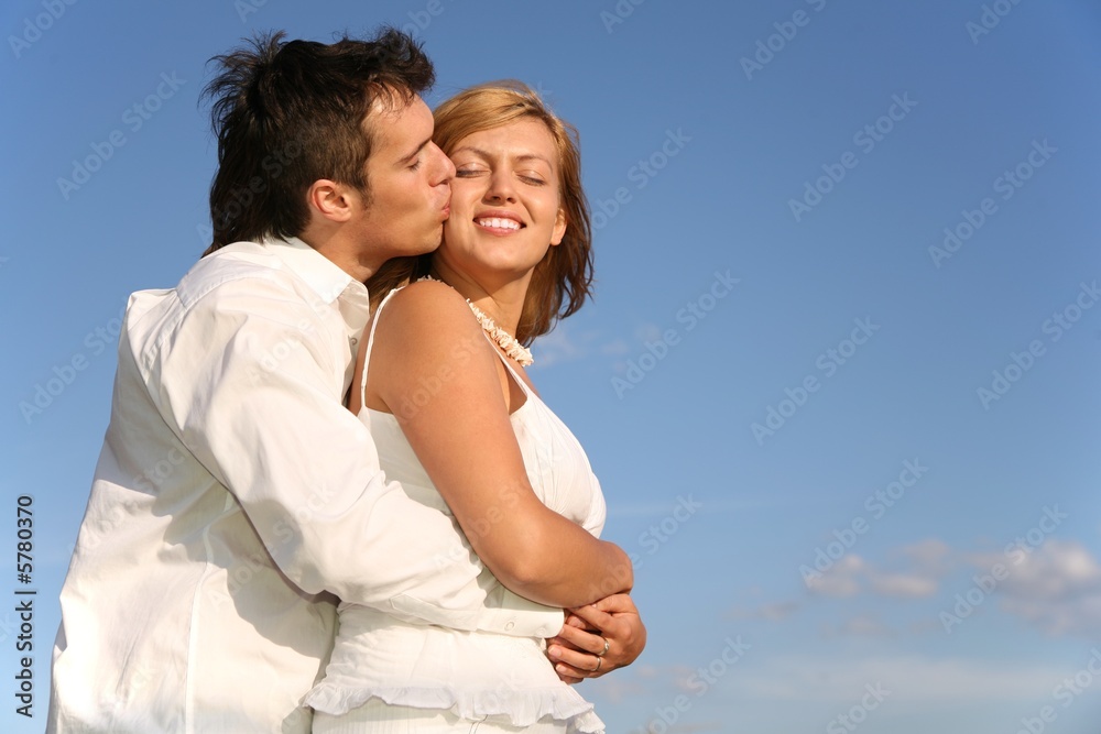man kisses woman man kisses woman