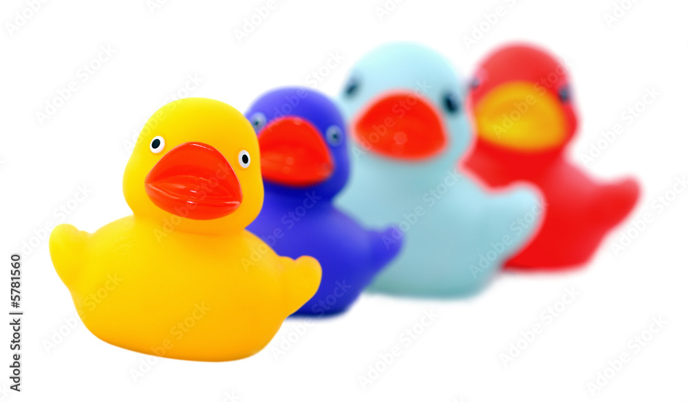 Isolated shot of four rubber ducks, focus on front duck. Isolated shot of four rubber ducks, focus on front duck.