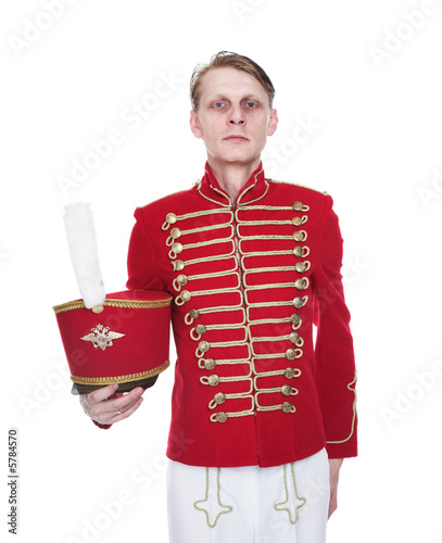 Fotografie The cheerful hussar on a white background