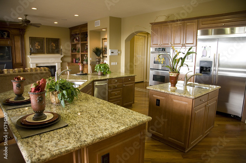 Luxury home kitchen with a granite top island. 