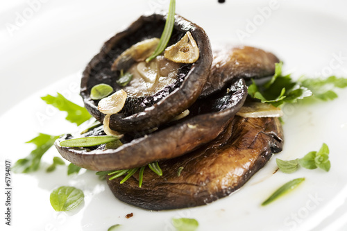 grilled portobello mushrooms, covered in herbs and garlic