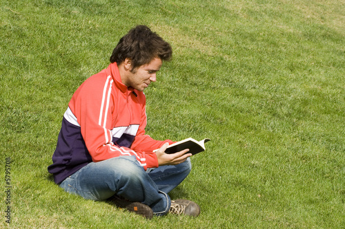 young man sit in the park enjoying the fresh air 