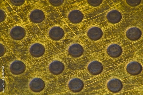 Punched Brass Metallic Background