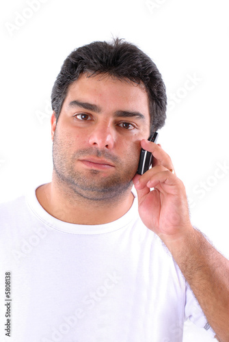 Young man hearing somebody in mobile phone .