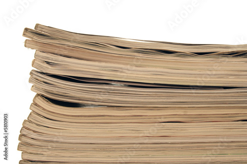 stack of magazines over white.