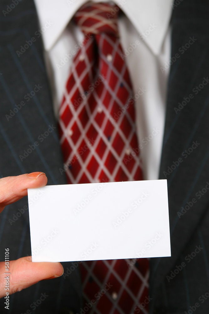 blank business card in color white in front of suit and tie blank business card in color white in front of suit and tie
