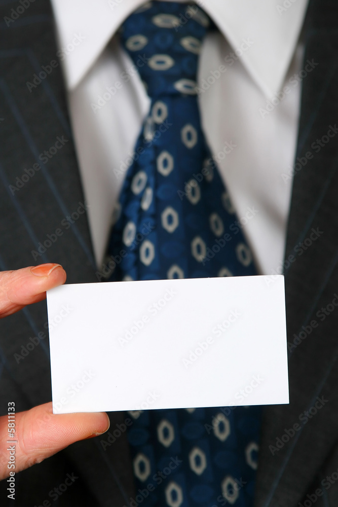 blank business card in color white in front of suit and tie blank business card in color white in front of suit and tie