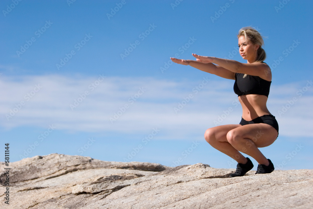 Young woman doing yoga outdoors