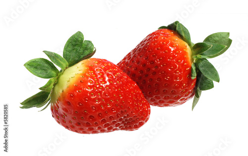 Two appetizing brightly red strawberries on a white background