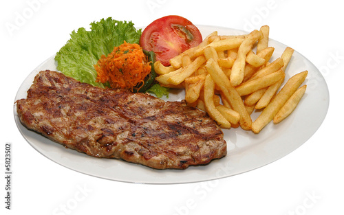 Fresh steak with potatoes and lettuce
