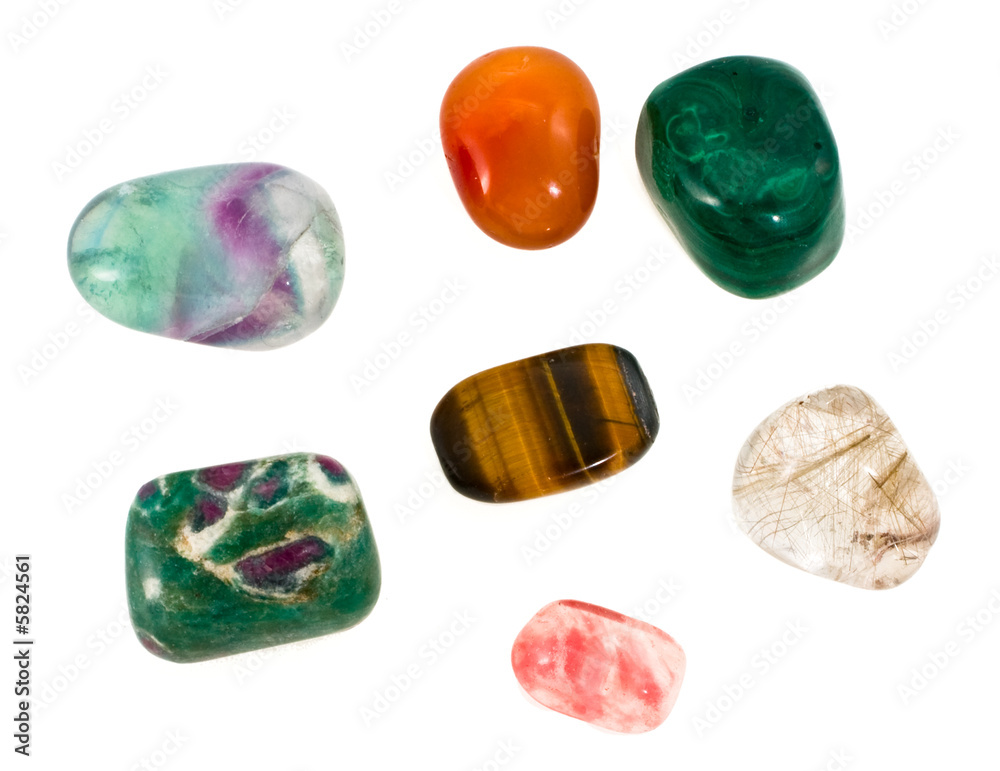 Multi-coloured ornamental stones on a white background Multi-coloured ornamental stones on a white background
