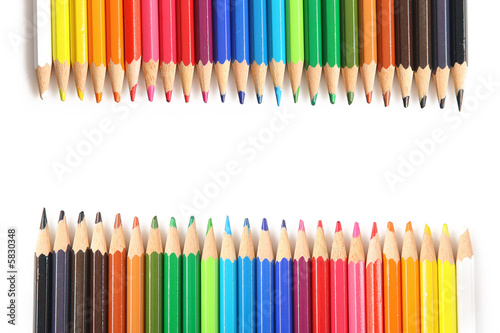 many colors of pencils situated on a both sides