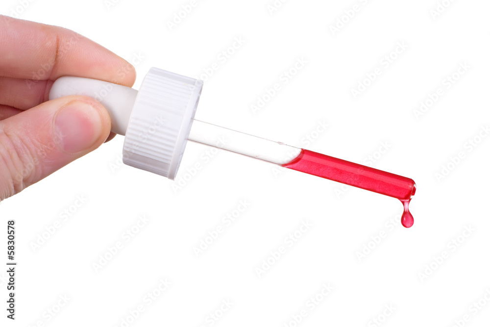 male hand holding dropper with red liquid dripping male hand holding dropper with red liquid dripping